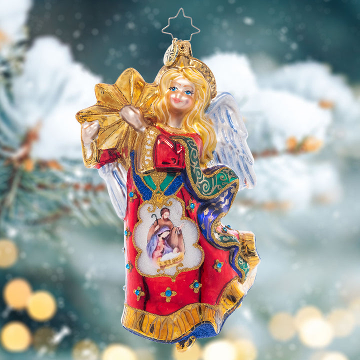 Ornament Description - Christmas Star Angel: Soaring on wings of hope and love, this Christmas angel bears a golden star and a beautiful vignette of baby Jesus in the manger, a wonderful piece to celebrate the season.