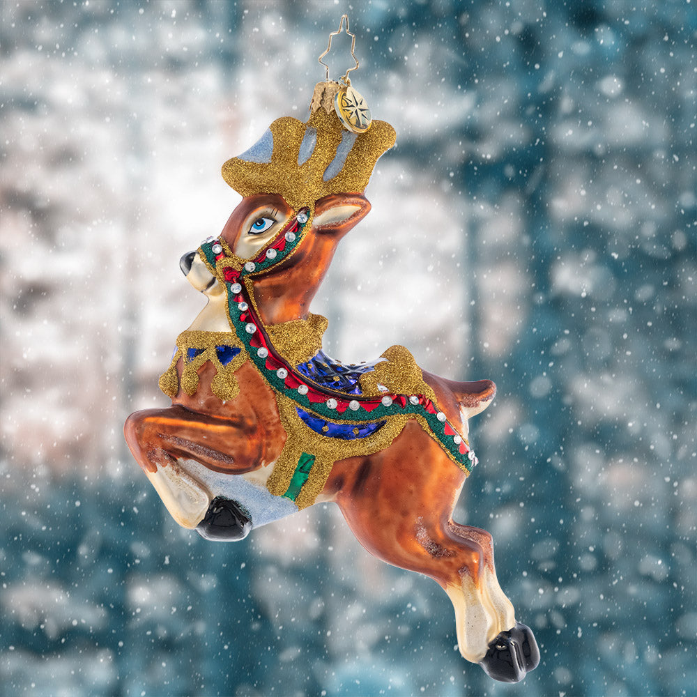 Ornament Description - Take to the Skies: Magnificent and mounted with a holiday saddle, this leaping stag is ready to bring Christmas joy to your tree.
