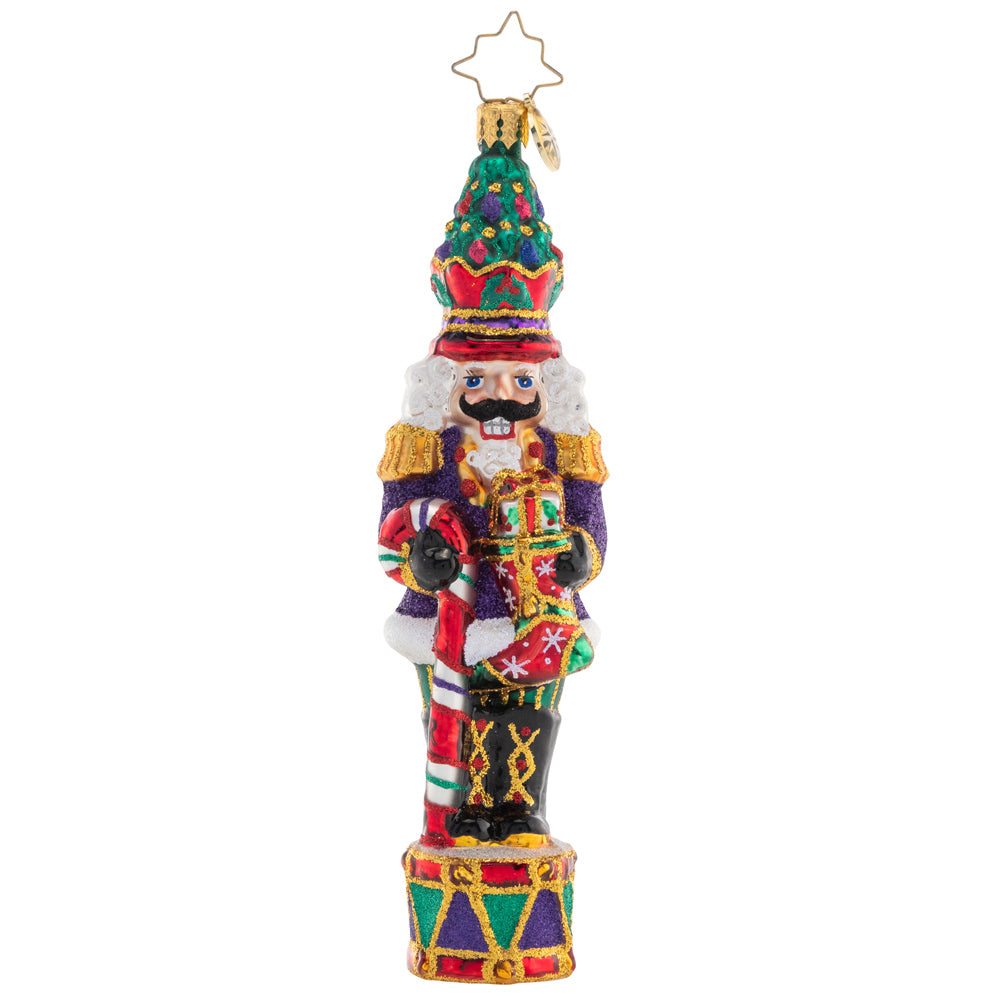Front - Ornament Description - Christmas Commander Nutcracker: Complete with a Christmas tree crown, this nutcracker is truly a commanding presence! He's ready to make this holiday the best one yet with a candy cane staff and plenty of gifts.