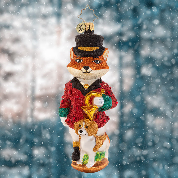 Ornament Description - Festive Fox: This sly fox is looking especially stylish in a red suit coat and top hat – the perfect attire for a holiday soirée.
