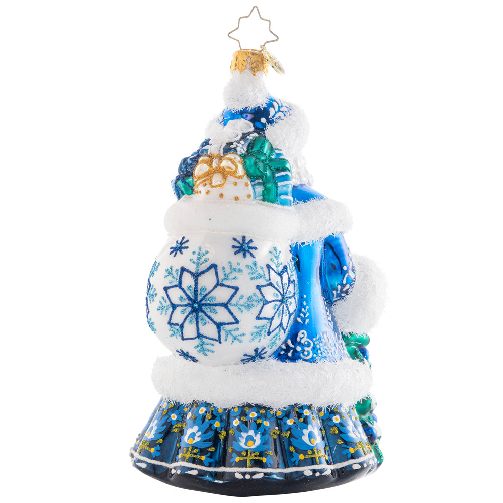 Back - Ornament Description - Winter Hues Santa: Dressed from head-to-toe in cool winter blues, Santa totes a splendid giftsack embellished with intricate snowflakes. Even his noble fir tree is trimmed in blue!