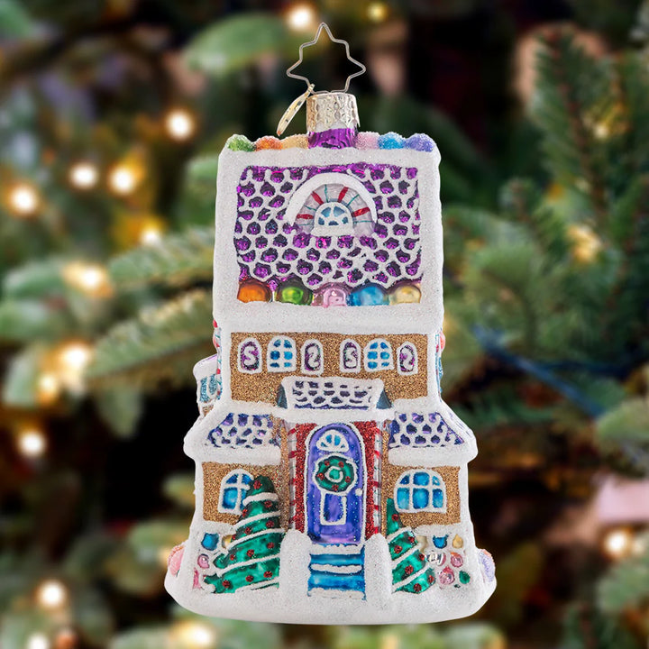 Ornament Description - Sweet Chalet: Charmingly dusted with icing snow drifts and colorful gumdrops, this magnificent tri-level treat is the sweetest gingerbread house on the block!