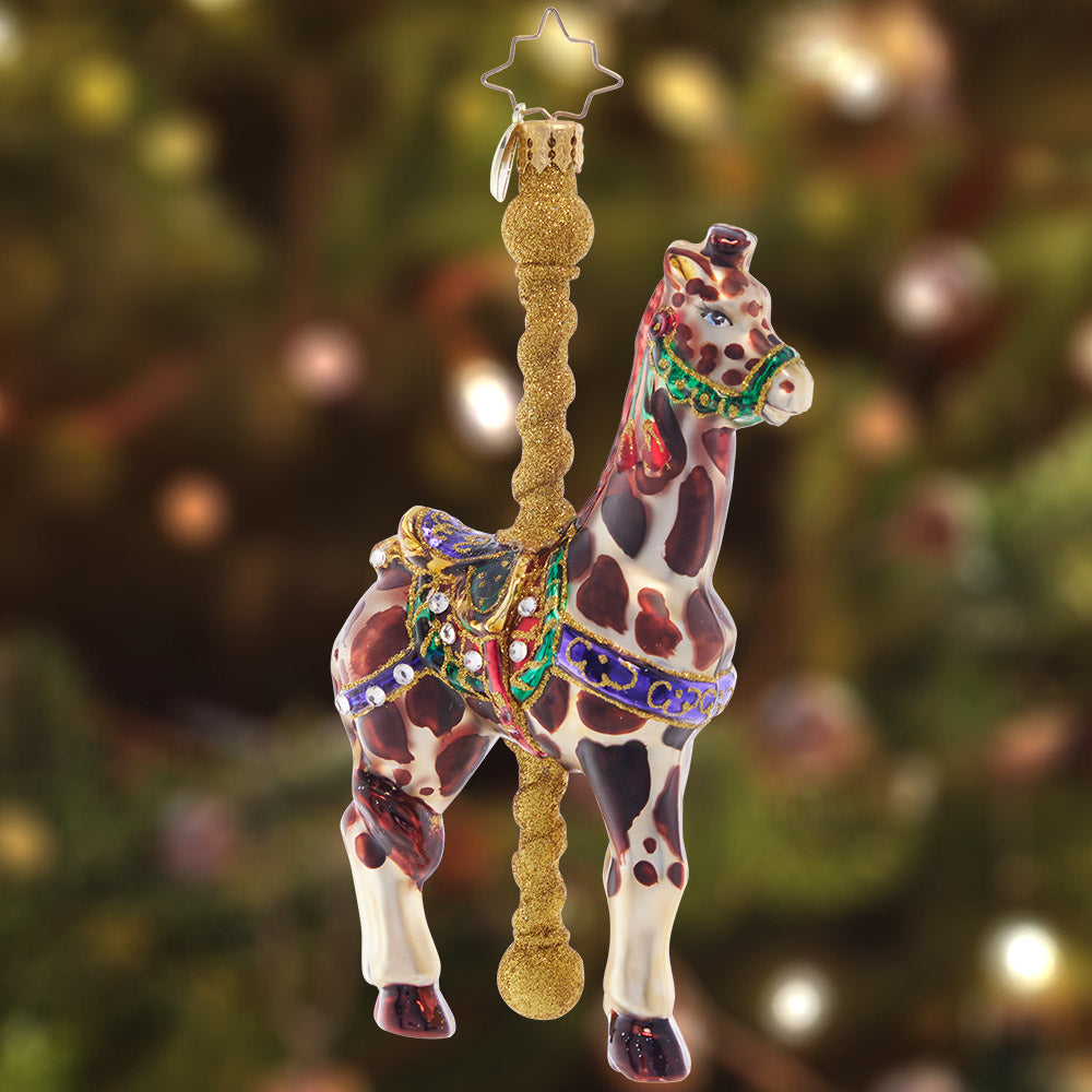 Ornament Description - Gilded Giraffe: How's the weather up there? This gloriously gilded giraffe stands tall and proud, the standout star of the carousel ride.