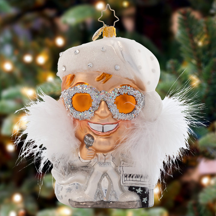 Ornament Description - Holiday "Star": The Legend- nobody eclipses his stardom! This radiant Elton John ornament embodies everything the world loves about our Rocket Man: Showmanship, talent, and music for the ages. He's ready to steal the show on your Christmas tree this year!
