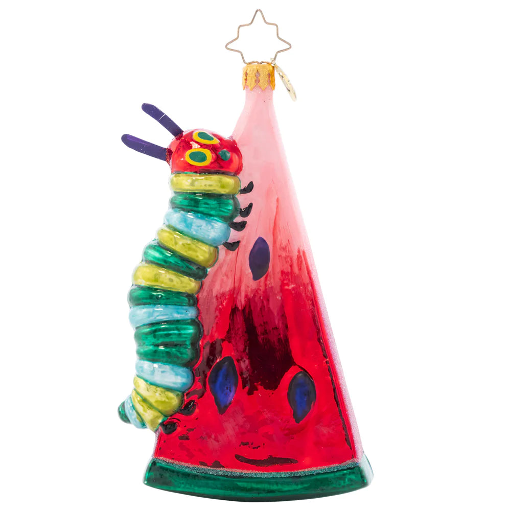 Front - Ornament Description - Caterpillar Cravings: The Very Hungry Caterpillar is no different than us… It's impossible to resist the temptation of a juicy watermelon. Eric Carle's beloved character climbs his meal in persistent search for more goodies in this shimmery ornament.