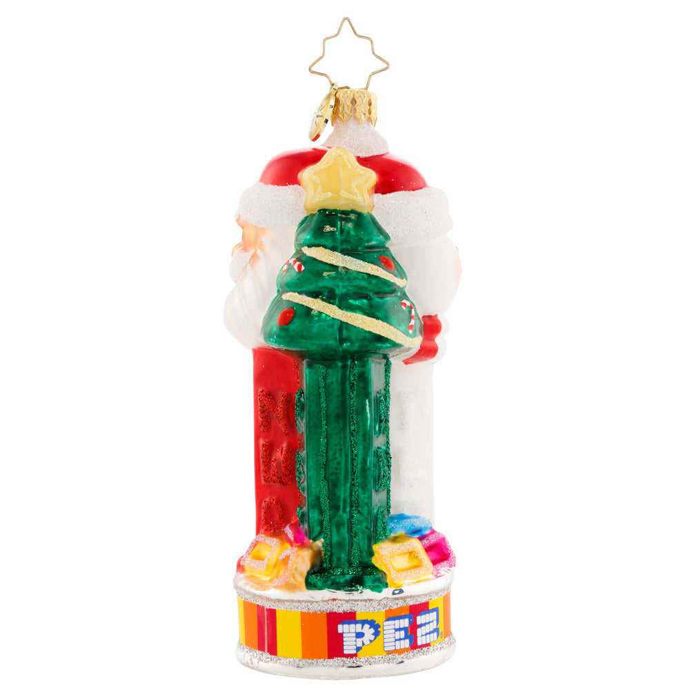 Side View 2 of 3 - Ornament Description - Jolly PEZ™: Bring iconic cheer to your holiday décor with this festive display of PEZ™ Candy dispensers. Three PEZ™ dispensers of Tannenbaum, Snowman and Santa Claus characters all atop the colorful trademark candy wrapper base.