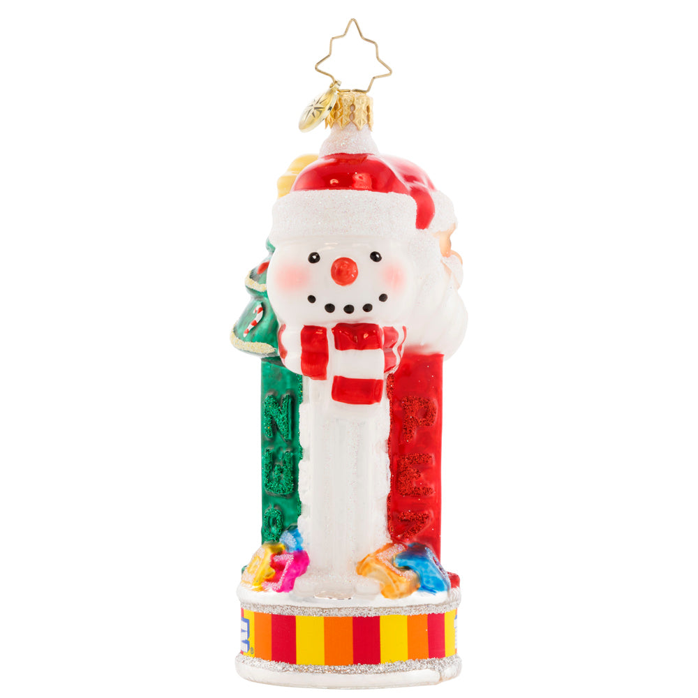 Side View 3 of 3 - Ornament Description - Jolly PEZ™: Bring iconic cheer to your holiday décor with this festive display of PEZ™ Candy dispensers. Three PEZ™ dispensers of Tannenbaum, Snowman and Santa Claus characters all atop the colorful trademark candy wrapper base.