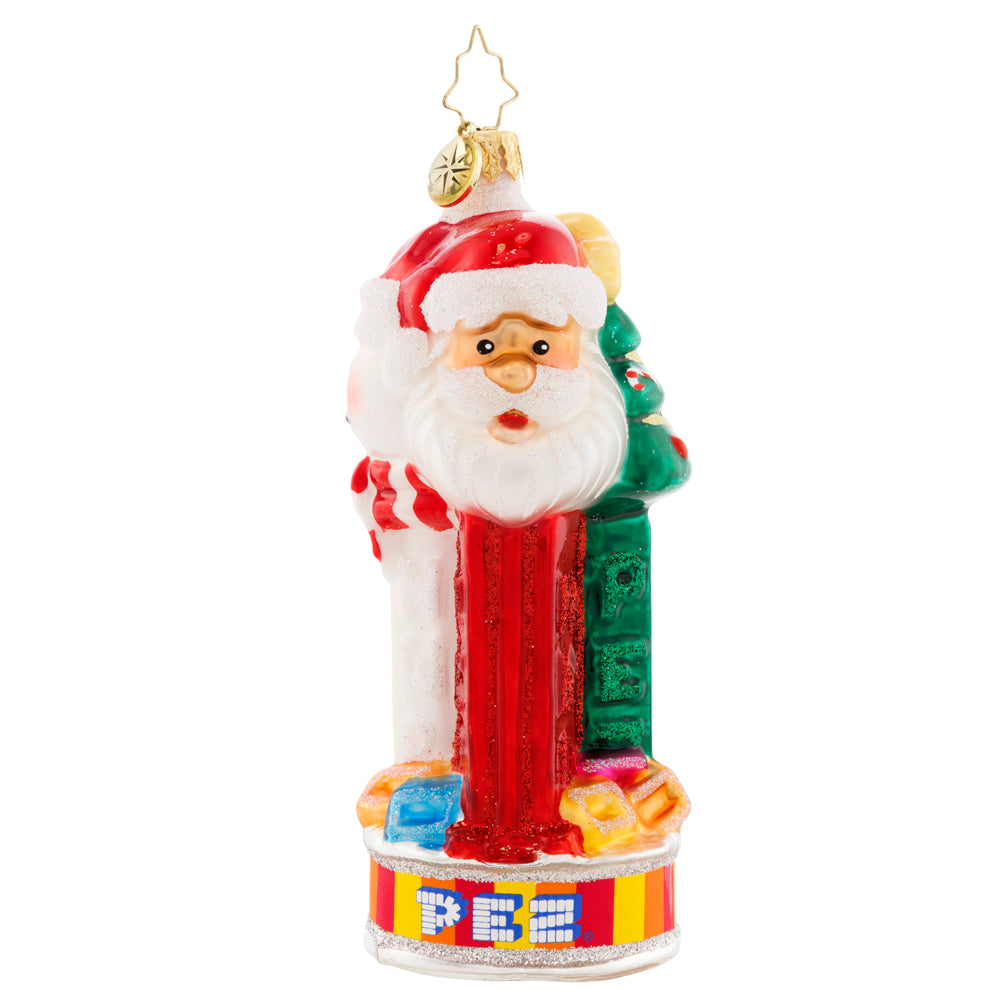 Side View 1 of 3 - Ornament Description - Jolly PEZ™: Bring iconic cheer to your holiday décor with this festive display of PEZ™ Candy dispensers. Three PEZ™ dispensers of Tannenbaum, Snowman and Santa Claus characters all atop the colorful trademark candy wrapper base.