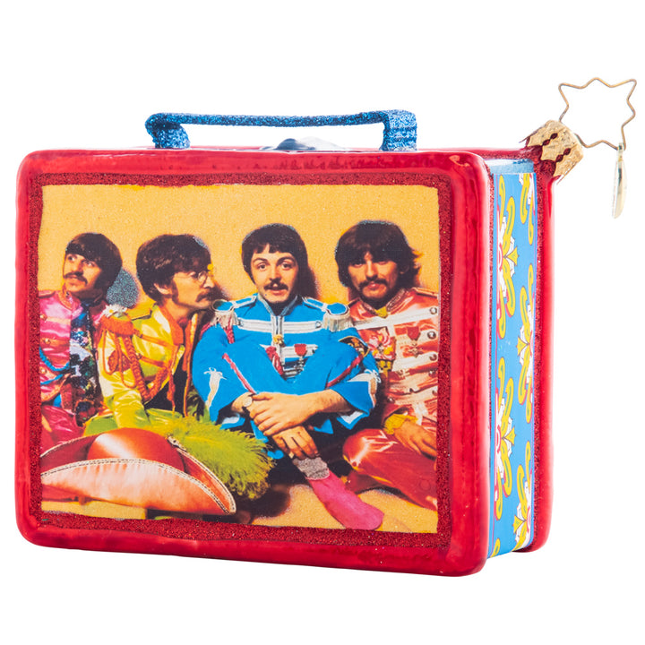 Back - Ornament Description - Sgt. Pepper Lunch: The hottest lunchbox in the school cafeteria! This replica of a collector's item is its own cherished piece! This ornament miraculously features the album art for the iconic Sgt Pepper's Lonely Hearts Club Band in all its stunning detail.