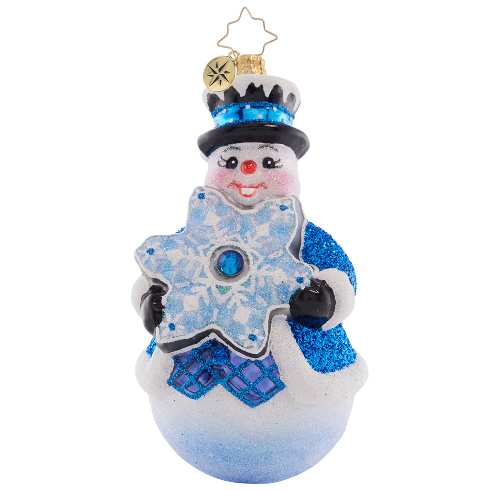 Front - Ornament Description - Flakey Frosty: Showing off his stunning star-shaped snowflake, this frosty friend is a vibrant vision in blue.