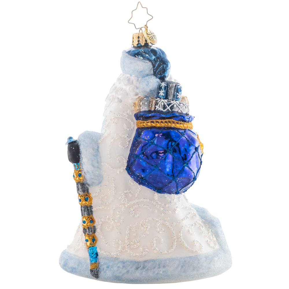 Back - Ornament Description - Winter Wonderland Santa: Strutting in a winter wonderland…Santa strolls comfortably with his bejeweled staff and cozy ice-blue coat. His owl friend sits atop his shoulder to keep him company.