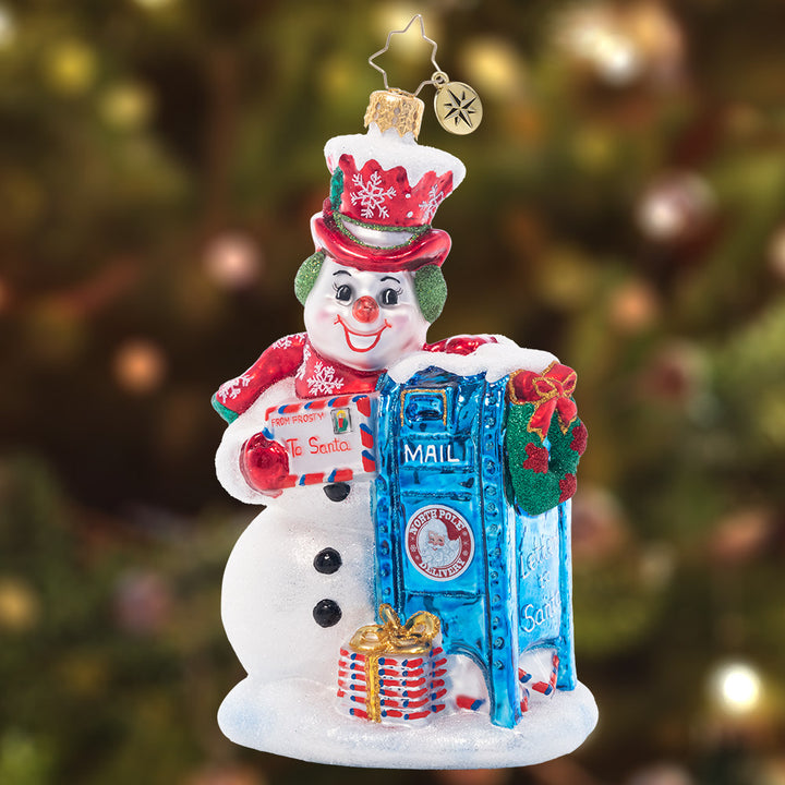 Ornament Description - Frosty Letter Delivery: Even on a frosty day, he'll brave the cold to send a letter on its way. A child's wish list must make it north, so that presents will be be brought forth!