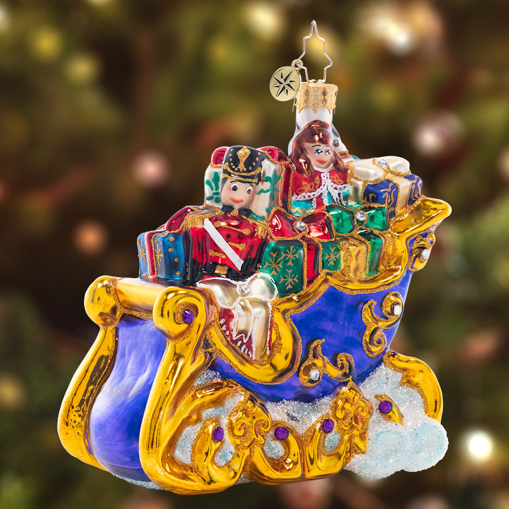 Ornament Description - Sleighful of Gifts: This stocked-up sleigh looks like it's floating atop fluffy cloud – on its way to spread joy to all the good little girls and boys this Christmas, no doubt!
