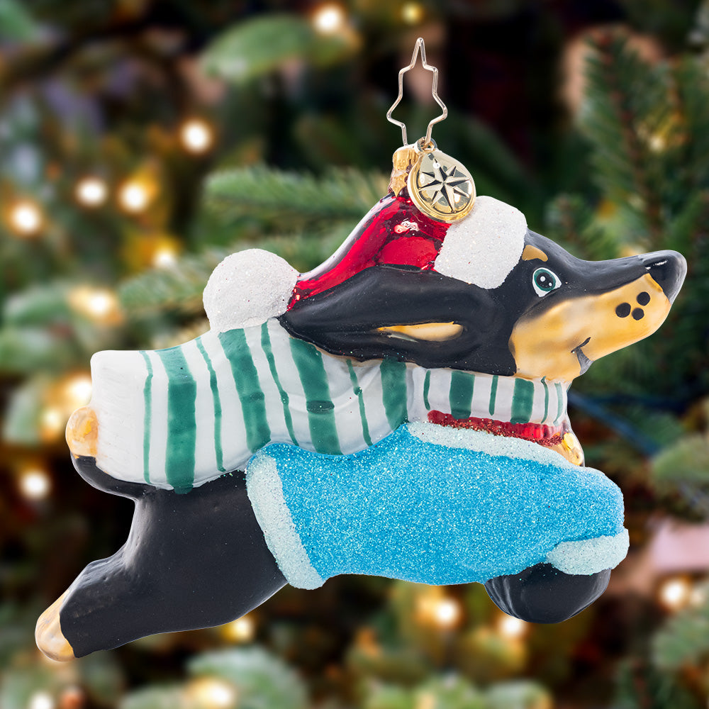 Ornament Description - Santa Paws: Dog gone! This prancing pooch is looking cheerful as ever in a Christmas sweater and Santa hat.