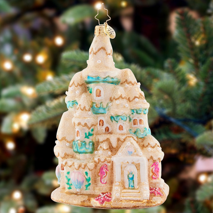 Ornament Description - Castle in the Sand: This beautifully-built Sandcastle is an idyllic home for all the little beach-dwelling creatures. Just watch out when the tide comes in!