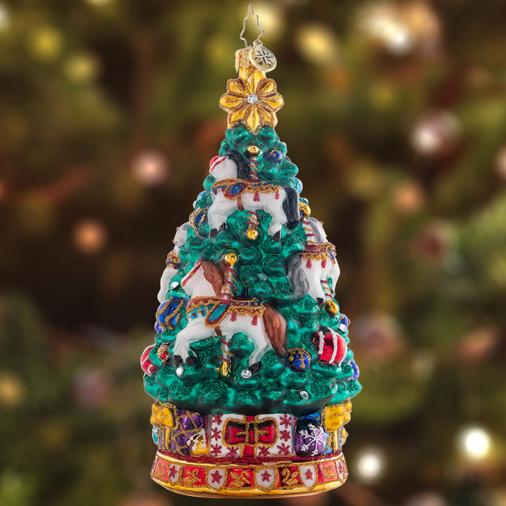 Ornament Description - Carousel Christmas Tree: As the carousel tree spins round and round, the sparkling horses twinkle among toys abound. Adorn your tree with this whimsical piece, and remember the joy of a classic carousel ride.