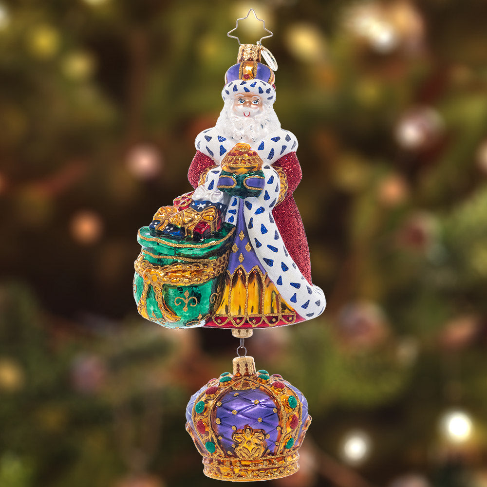 Ornament Description - The King Of Christmas: With his luxurious, fur-lined robe, bag of golden gifts, and carefully-bejeweled crown, this royal Santa is sure to be the king of your Christmas tree. This special ornament has been hand-picked by the Radko team to be part of the Limited Edition collection.