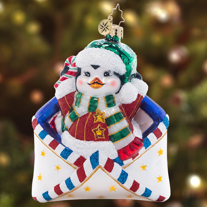 Ornament Description - Penguin Delivery: You've got mail – and an adorable penguin pal! This flightless friend will make sure your Christmas list arrives safely to the North Pole in time for the holiday season.
