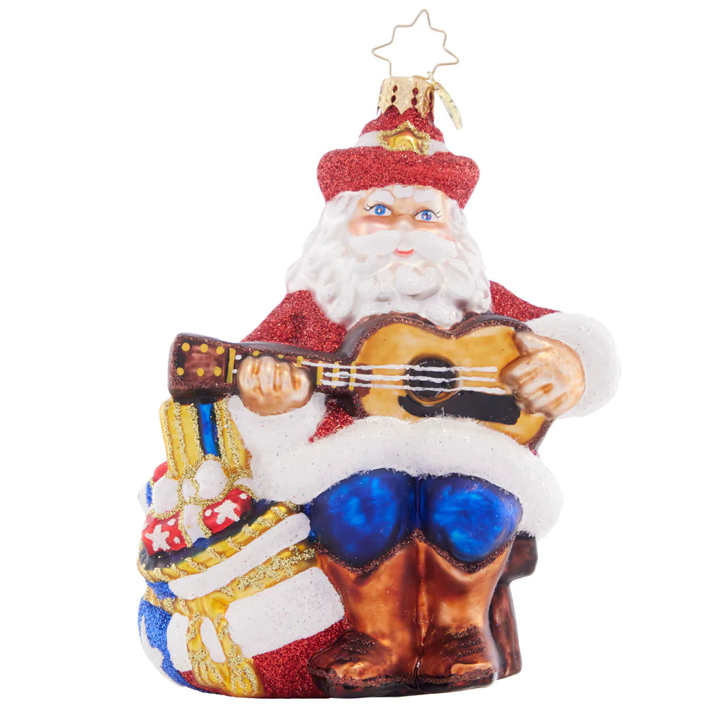 Front - Ornament Description - Lone Star Seranade Santa: Lone star santa strums his four-string, showing his Texas pride with a star-spangled bag of Christmas gifts at his side.