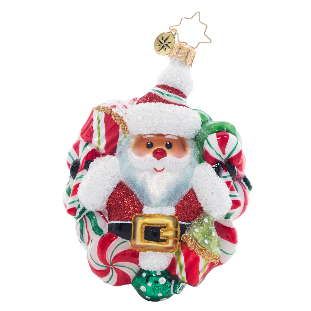 Front - Ornament Description - Peppermint Dreams Santa: This darling Santa is surrounded by a wreath of delicious peppermints. Decorate your tree with this candy-coated red and green treat!