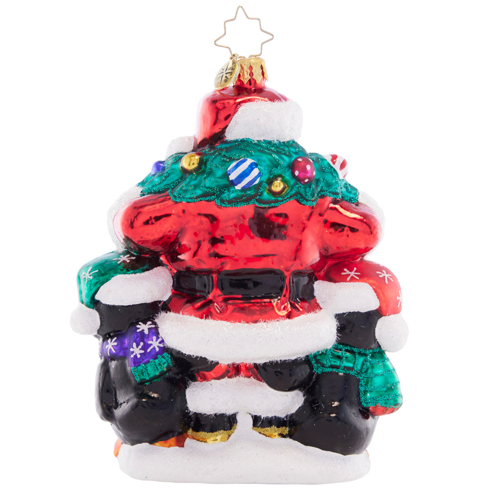 Back - Ornament Description - Polar Portrait: Surrounded by a plethora of playful penguins and a joyful wreath, Santa is feeling festive and ready to celebrate the holiday season!