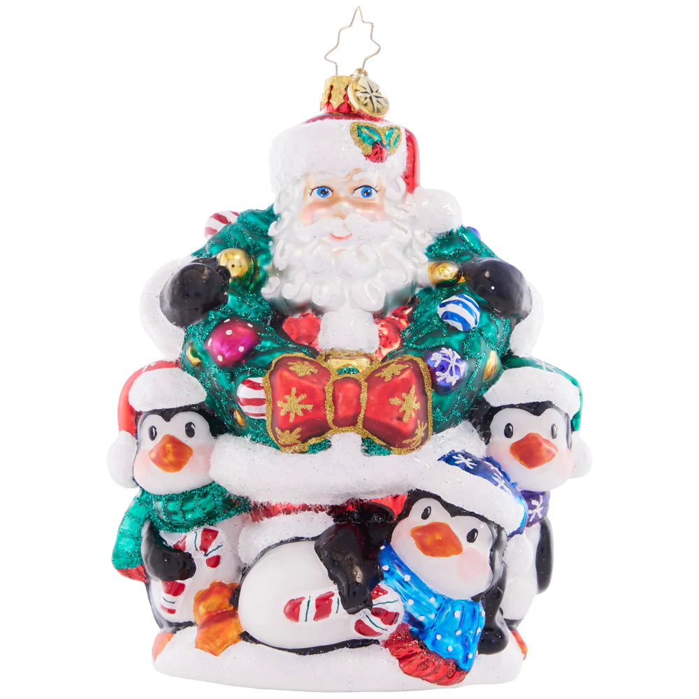Front - Ornament Description - Polar Portrait: Surrounded by a plethora of playful penguins and a joyful wreath, Santa is feeling festive and ready to celebrate the holiday season!