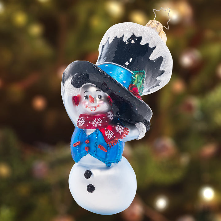 Ornament Description - Peek-A-Boo Snowman: There wasn't enough snow for this snowman to fully grow. He'll hide in his stylish top hat, but isn't too shy to chat. Don't be fooled by his size. He still wins the cuteness prize!
