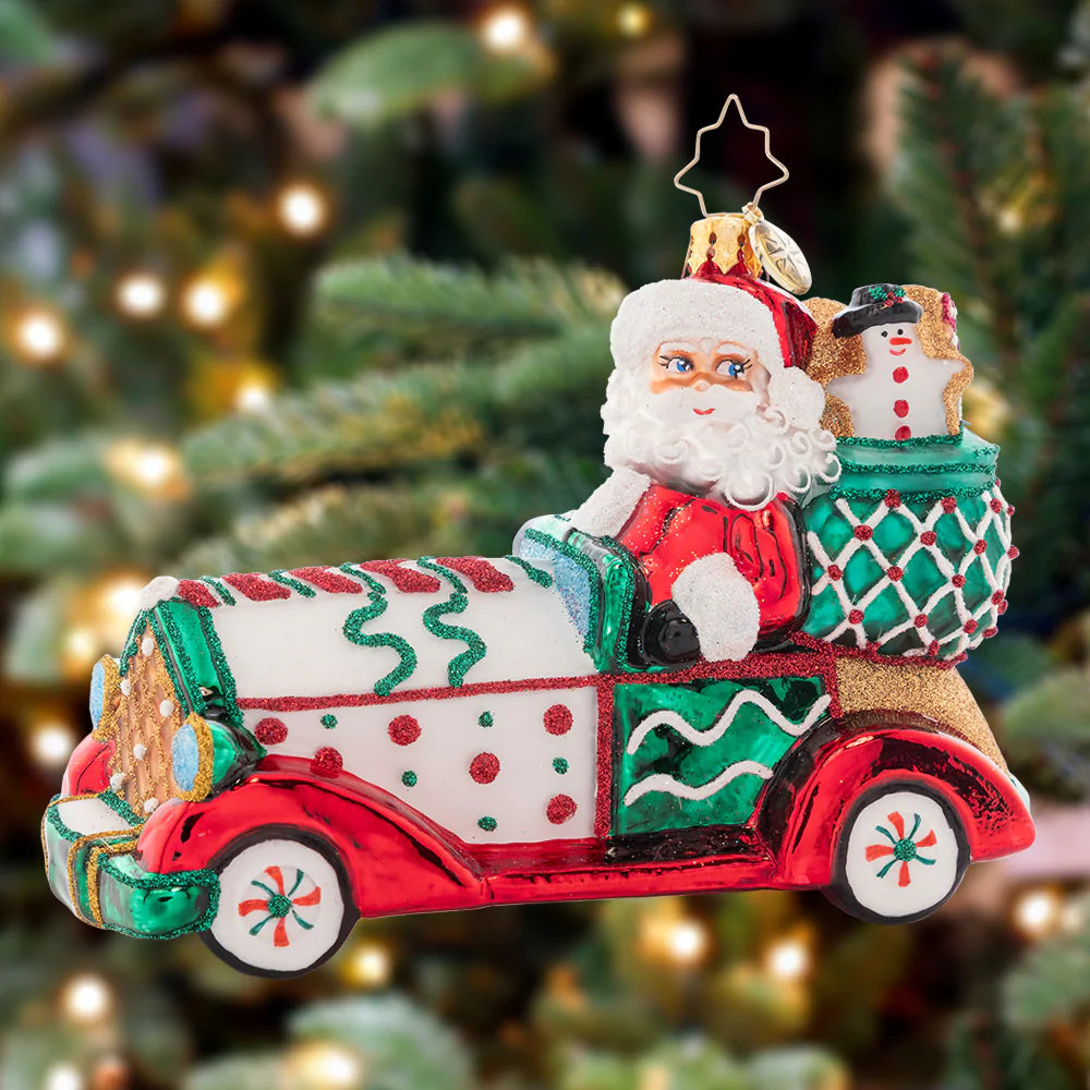 Ornament Description - Sweet Ride: Hop in santa's sugar-powered cookie car, and take a sweet ride to Candy Cane Lane! This Christmas-mobile is a cloying and clever addition to any tree.