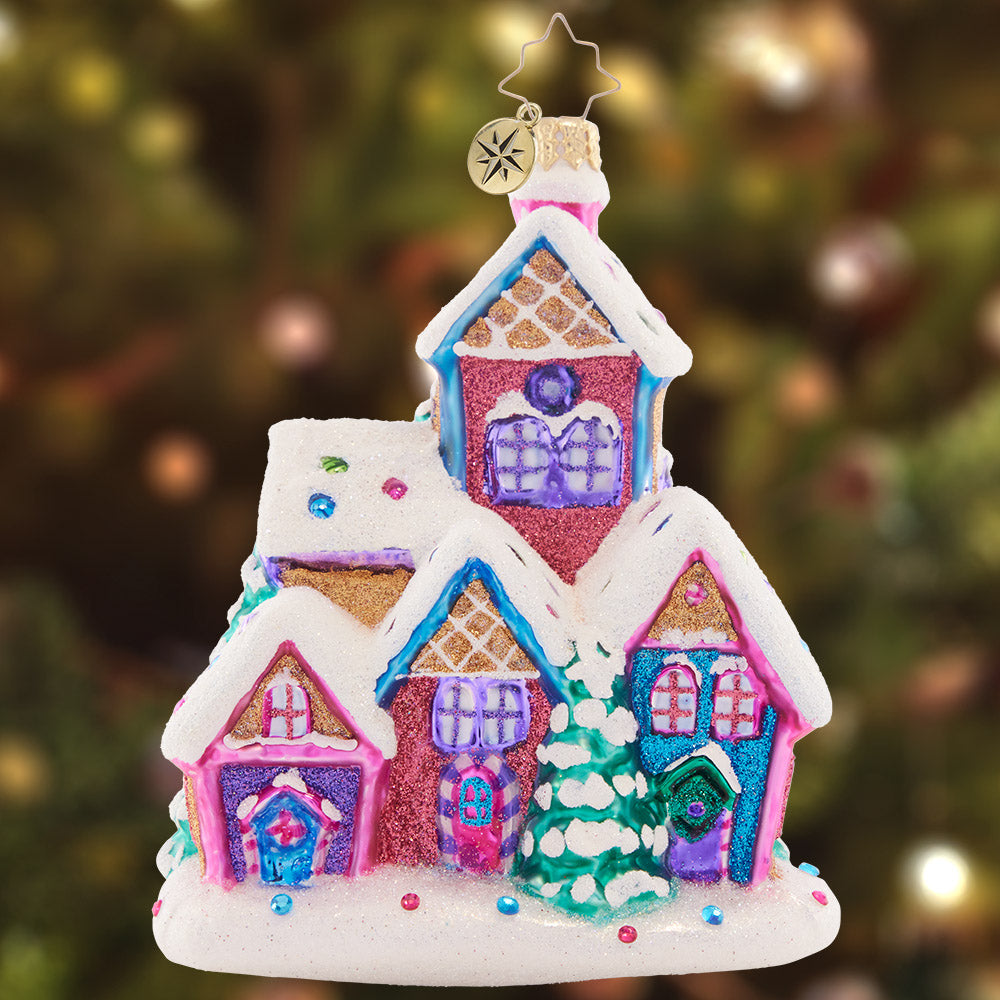 Ornament Description - Snow Covered Sweetness: Generously decorated with icing "snow" and colorful sprinkles, this delightful gingerbread house shows off special things that make this season so sweet.