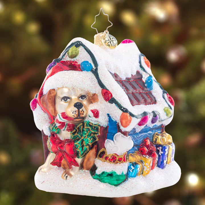 Ornament Description - Happy Howl-idays: Decked out with Christmas lights and a bone-laden wreath, this dog house is as cozy as can be!