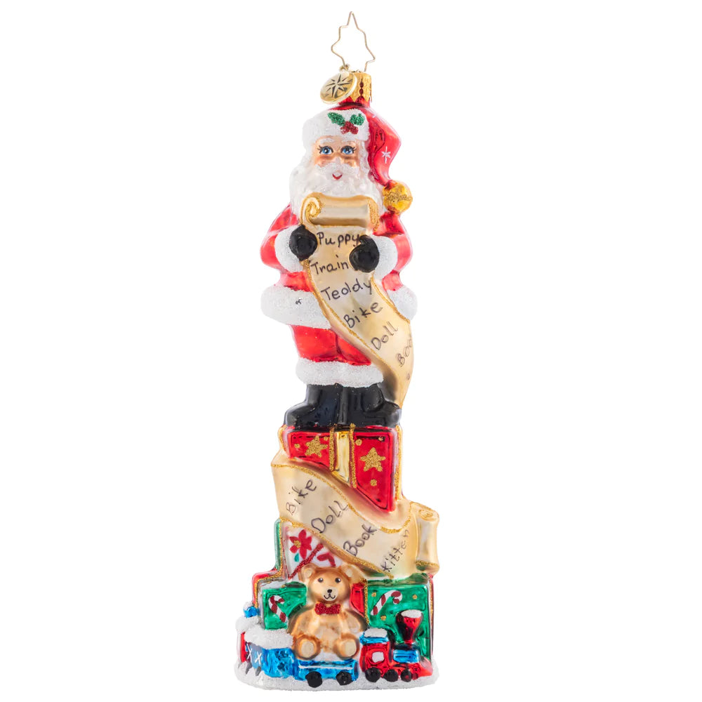 Front - Ornament Description - Stacked Up Santa: Quite a lengthy wish list this child sent in! Much time and consideration was spent filling it in. Santa has to stand on many presents stacked to check off each gift as they're carefully packed.
