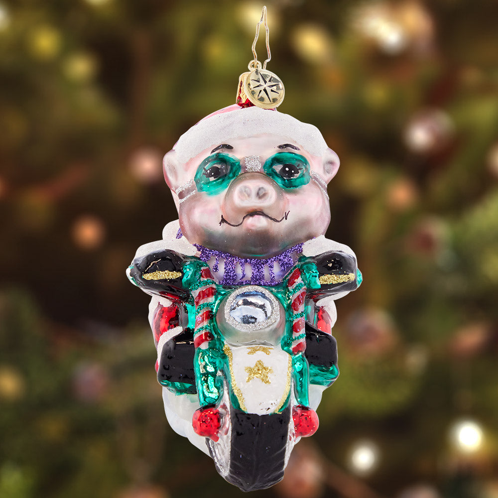 Ornament Description - Low Rider Hog: That's one speedy swine! This biker Santa is bad to the bone, cruising along the highway on a holiday hog.
