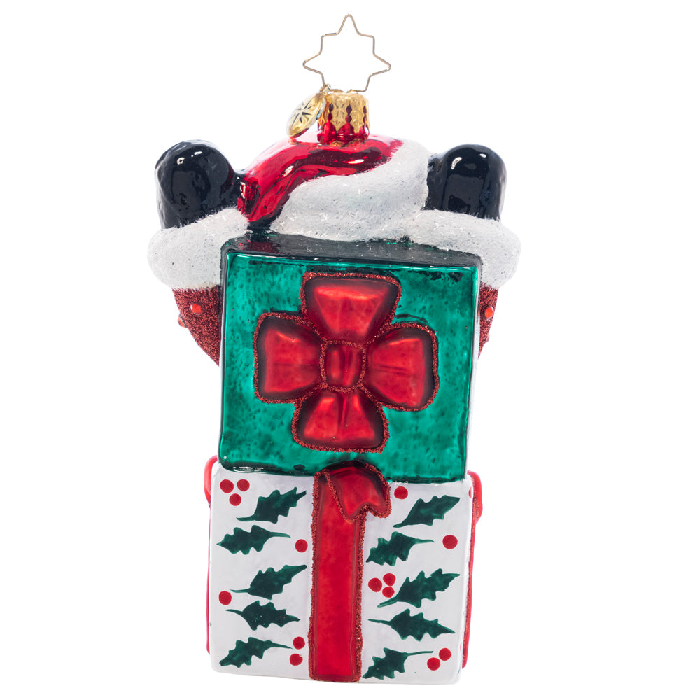 Back - Ornament Description - Santa-In-The-Box: Pop-goes-the-Santa! This jolly fellow is the most wonderful Christmas surprise, popping out of a holly-decked gift box.