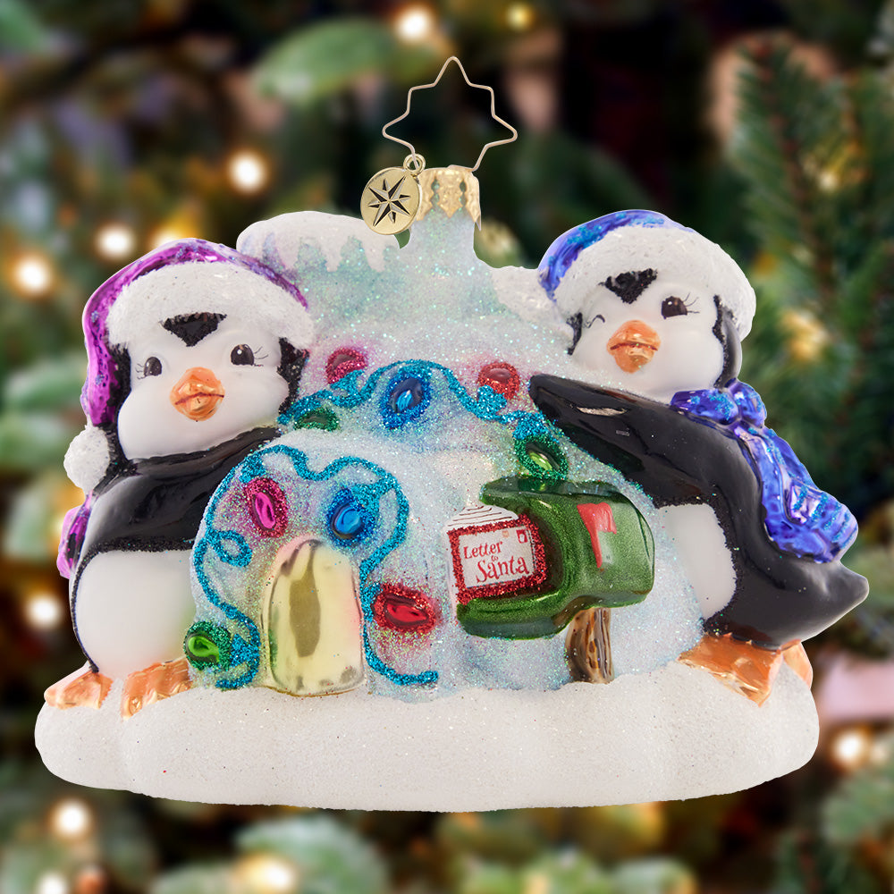 Ornament Description - Welcome Home Igloo: This pair of penguins have adorned their icy igloo in holiday lights, read to greet Santa on Christmas Eve!