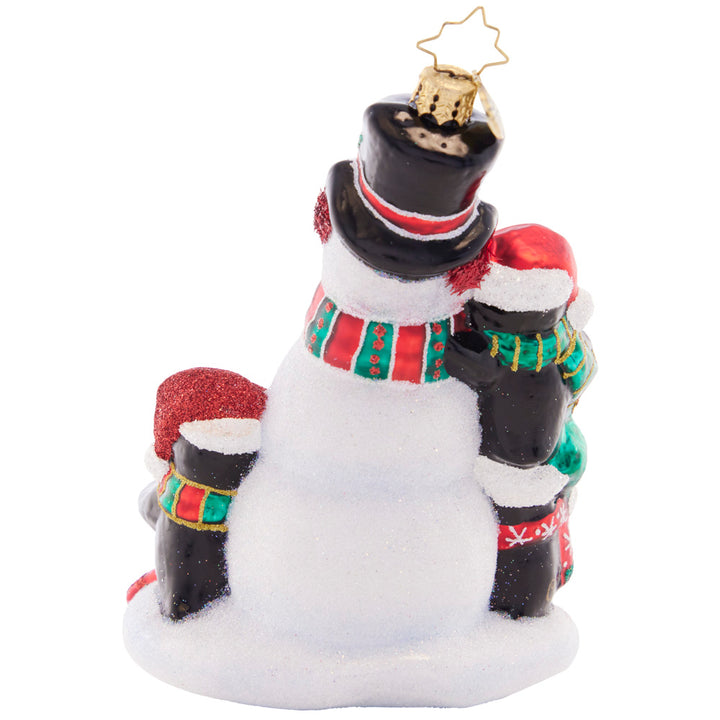 Back - Ornament Description - Building Friends in Cold Places: Ornament Descripion - Building Friends in Cold Places: A playful penguin trio is here to build the best snowman ever. They'll make the world come alive to share Christmas magic far and wide.