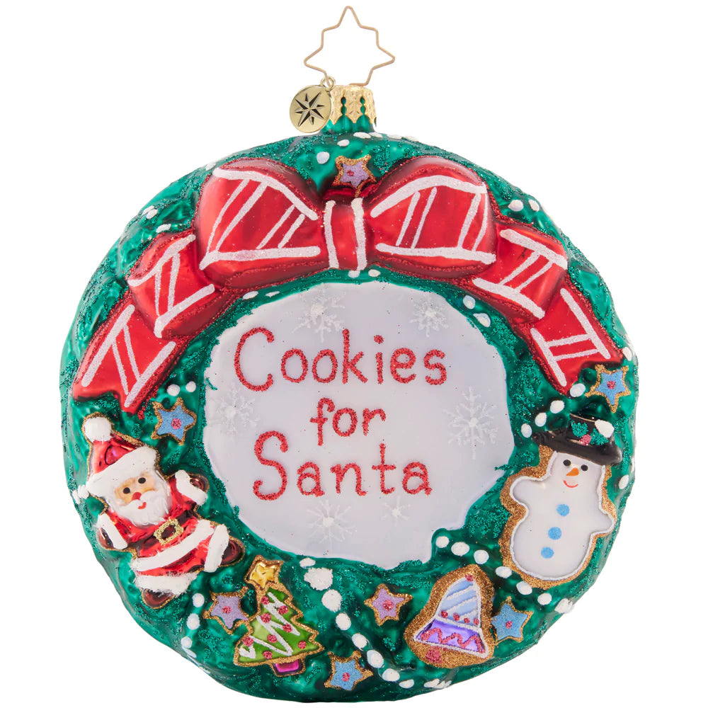 Front - Ornament Description - Cheerful Cookies Wreath: What better way to thank Santa for his hard work than with a cute, Christmas cookie-covered wreath? He's sure to enjoy this thoughtful and tasty treat.