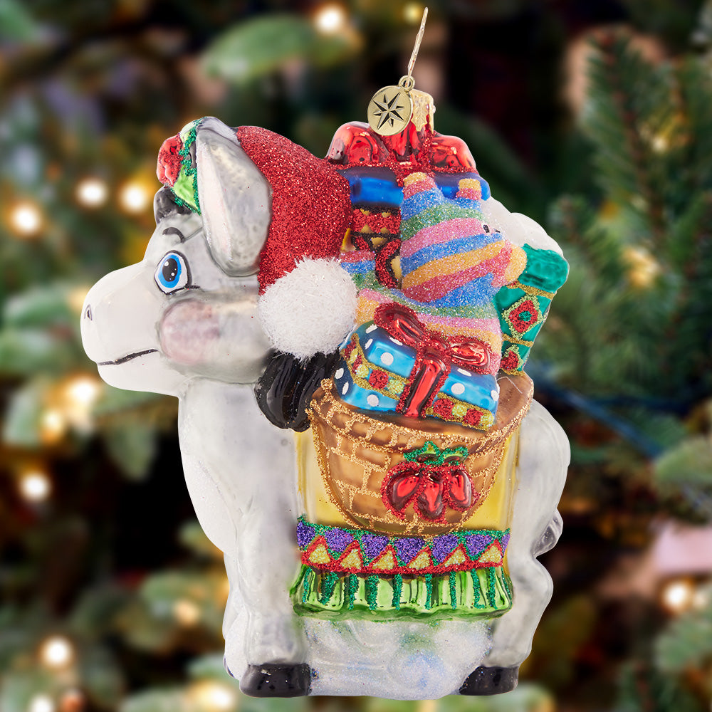 Ornament Description - Packed with Presents: Loaded to the brim with gifts galore, this festive pack-mule is delivering cheer wherever his travels take him!
