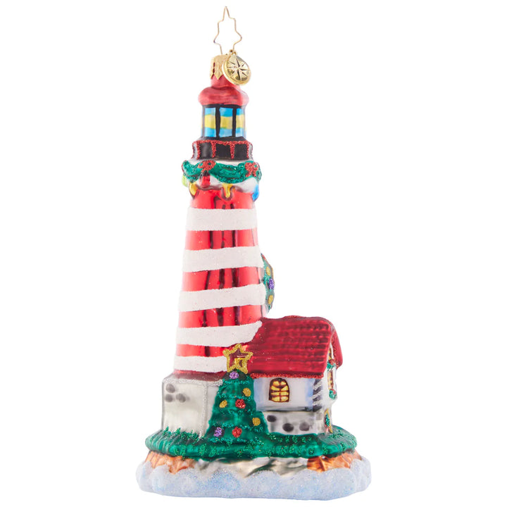 Back - Ornament Description - Light My Way Lighthouse: Perched atop a rocky cliffside, this candycane striped lighthouse shines a beacon of light to show Santa the way on a stormy Christmas night.