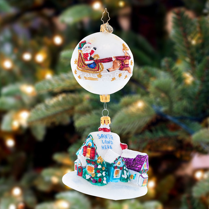 Ornament Description - Coming in for a Landing - 2023: Up on the housetop, click, click, click… Here comes the reindeer brigade, along with St. Nick! He'll try not to cause too much of a ruckus when he delivers his gifts, making his way through the snowdrifts.