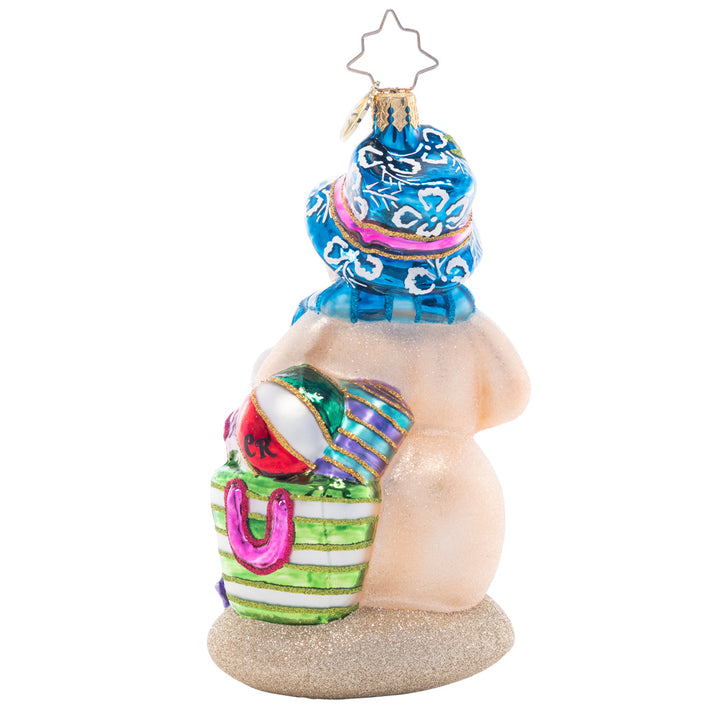 Back - Ornament Description - Beach Day Snow Friend: Basking in the sunshine, this sand-colored Snowman is happy to have a break from the cold winter weather! He's ready for the perfect beach day with a pail and shovel for sandcastle building.