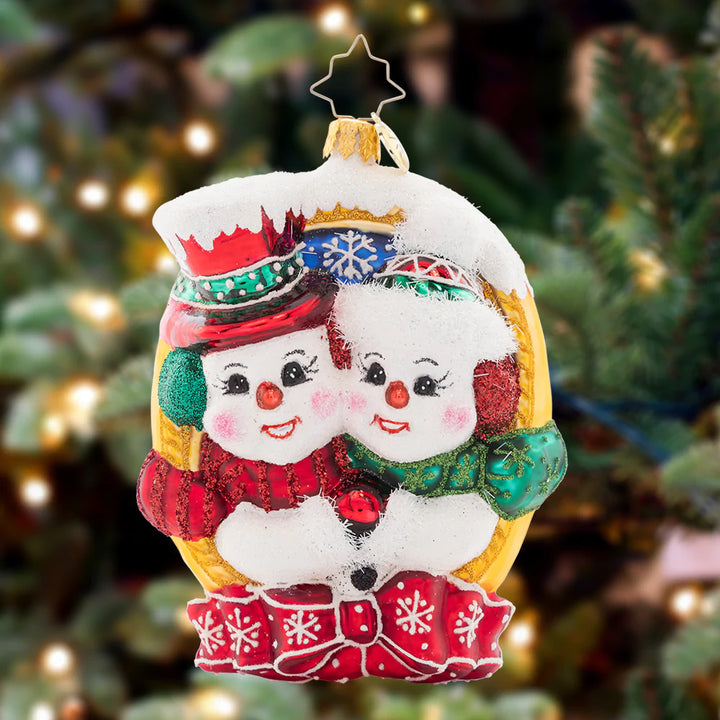 Ornament Description - A Picture Perfect Pair: These snow-sweeties are cheesing for the camera. They'll make the most picturesque pair on your tree this year, framed in gold and wrapped up in a bow!