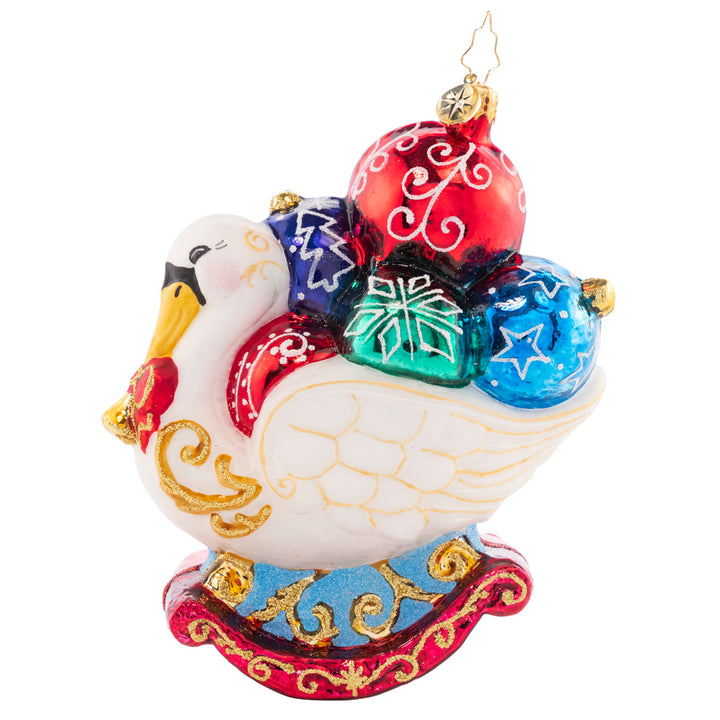Side View 1 of 2 - Ornament Description - Festive Feathers - 2023: What could be prettier than a festive swan who has gathered Christmas ornaments to flaunt among her feathers? This bird will compete with any tree for the best decorated, as you can see!