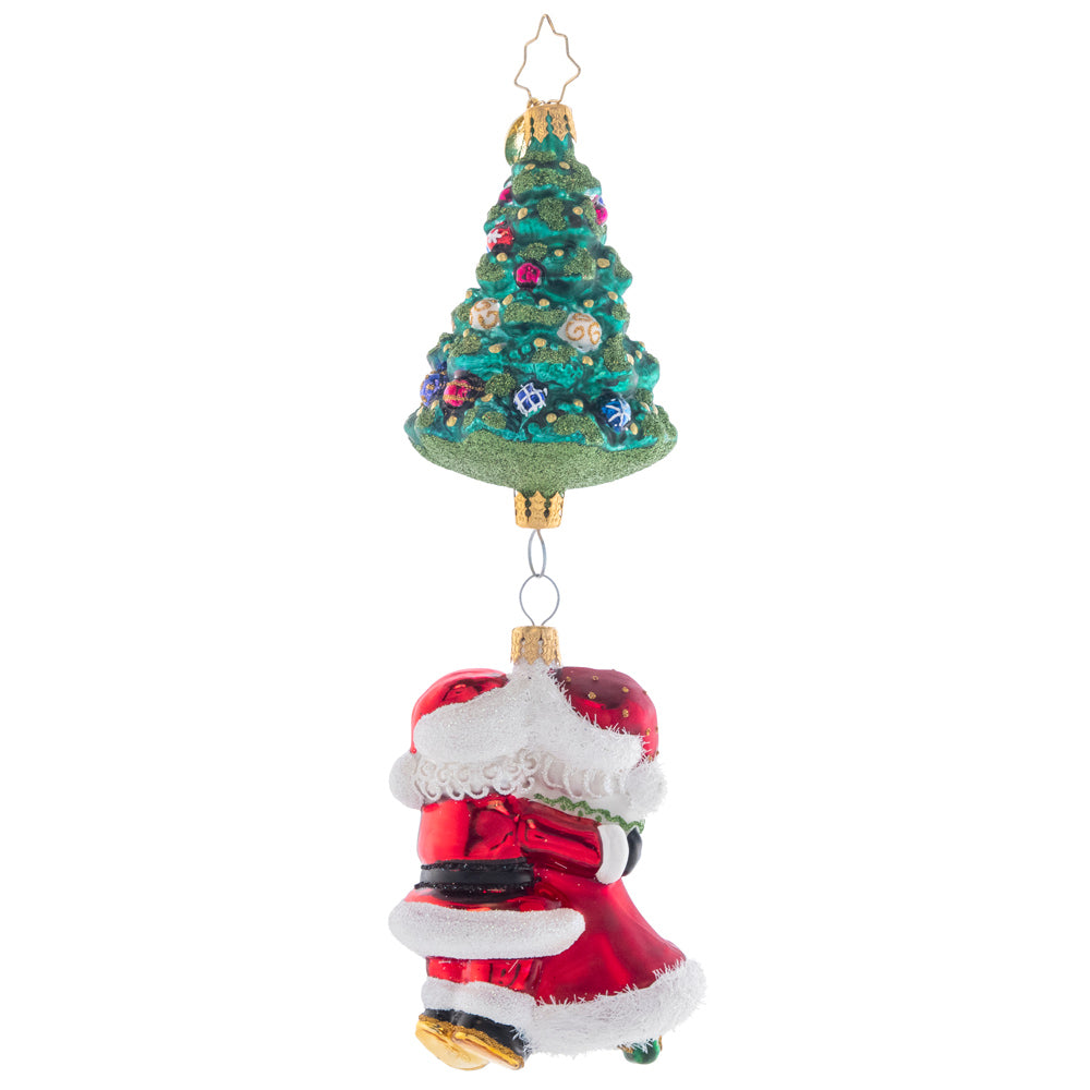 Back - Ornament Description - Meet Me Under the Tree: Mr. and Mrs. Claus sure do make a magnificent couple! These Christmas cuties dance together under a trimmed tree. Where's the mistletoe?