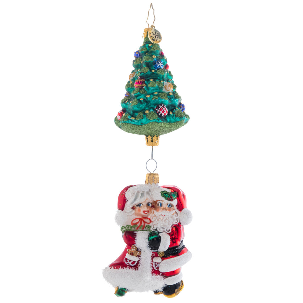 Front - Ornament Description - Meet Me Under the Tree: Mr. and Mrs. Claus sure do make a magnificent couple! These Christmas cuties dance together under a trimmed tree. Where's the mistletoe?