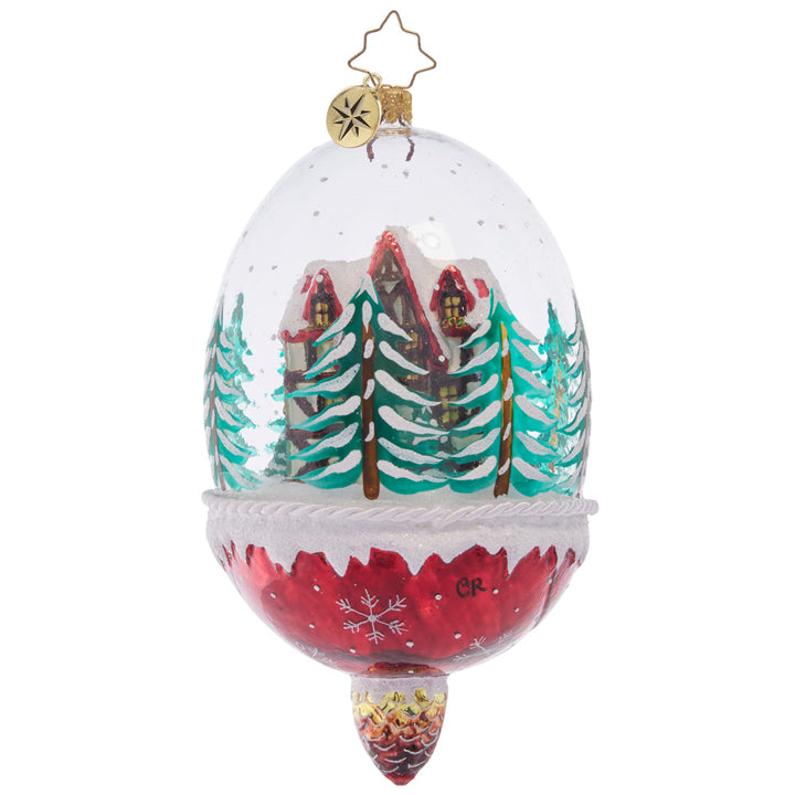 Back - Ornament Description - Winter Cottage Hideaway: Ensconced within a snow-filled dome, this cozy chalet surrounded by pine trees makes for a stunning winter scene. This special ornament has been hand-picked by the Radko team to be part of the Limited Edition collection.