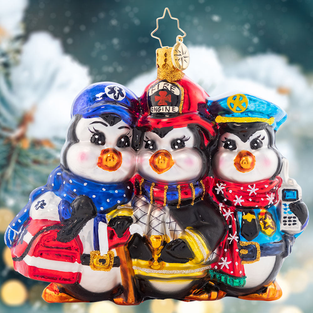 Ornament Description - First Responder Charity: A service trio that'll handle any winter emergency with the most dedicated urgency. No matter the bad weather, this penguin flock will always stick together. A percentage of the sales from this ornament will benefit a charity that supports first responders.