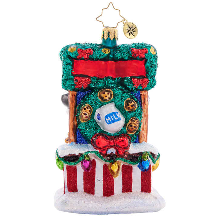 Back - Ornament Description - Santa's Sweet Treat Stand: After sampling Christmas cookies from around the world, Santa has worked out the tastiest secret recipe. Stop by his cookie stand for a sweet treat and a tall glass of milk, and get into the holiday spirit!