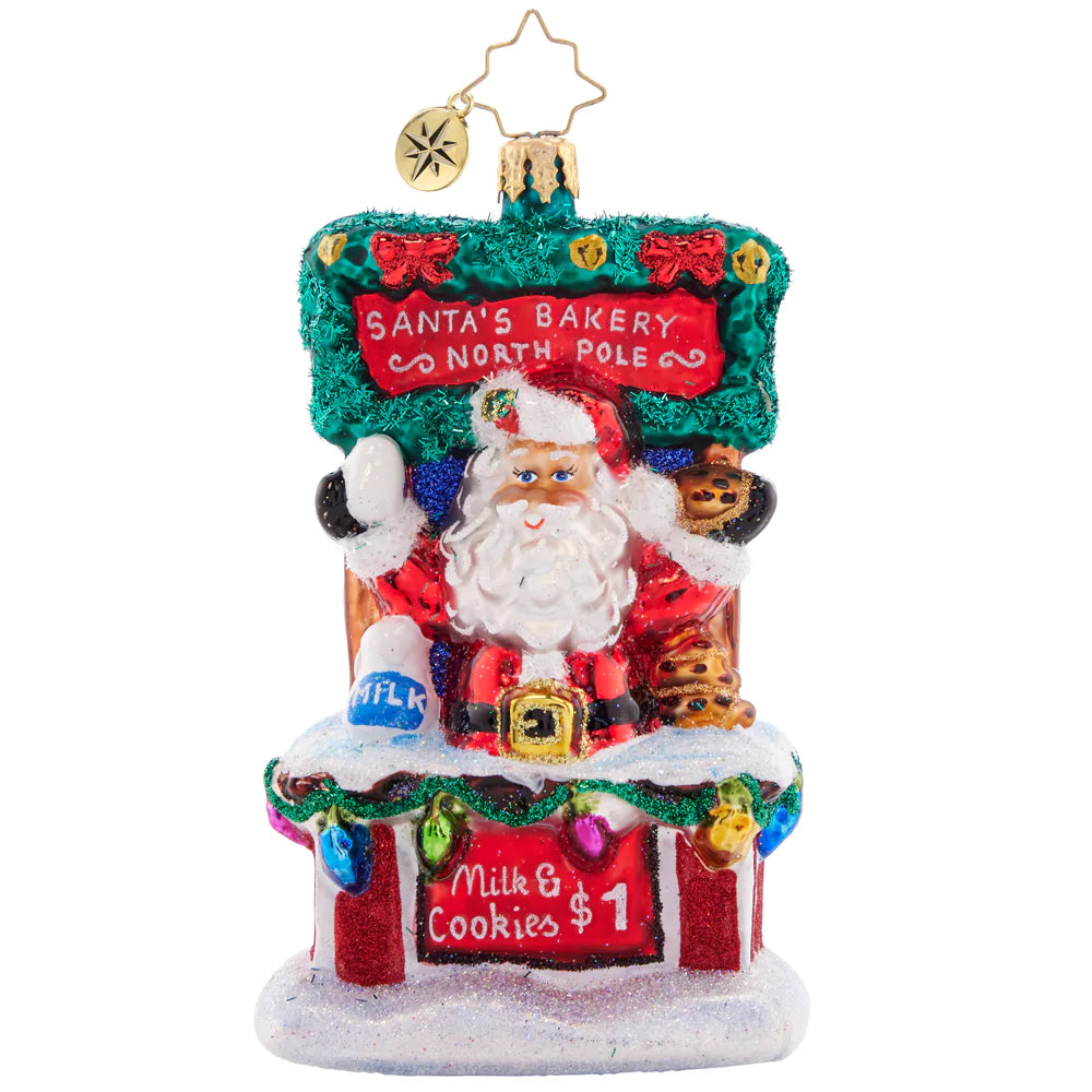 Front - Ornament Description - Santa's Sweet Treat Stand: After sampling Christmas cookies from around the world, Santa has worked out the tastiest secret recipe. Stop by his cookie stand for a sweet treat and a tall glass of milk, and get into the holiday spirit!