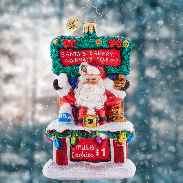 Ornament Description - Santa's Sweet Treat Stand: After sampling Christmas cookies from around the world, Santa has worked out the tastiest secret recipe. Stop by his cookie stand for a sweet treat and a tall glass of milk, and get into the holiday spirit!