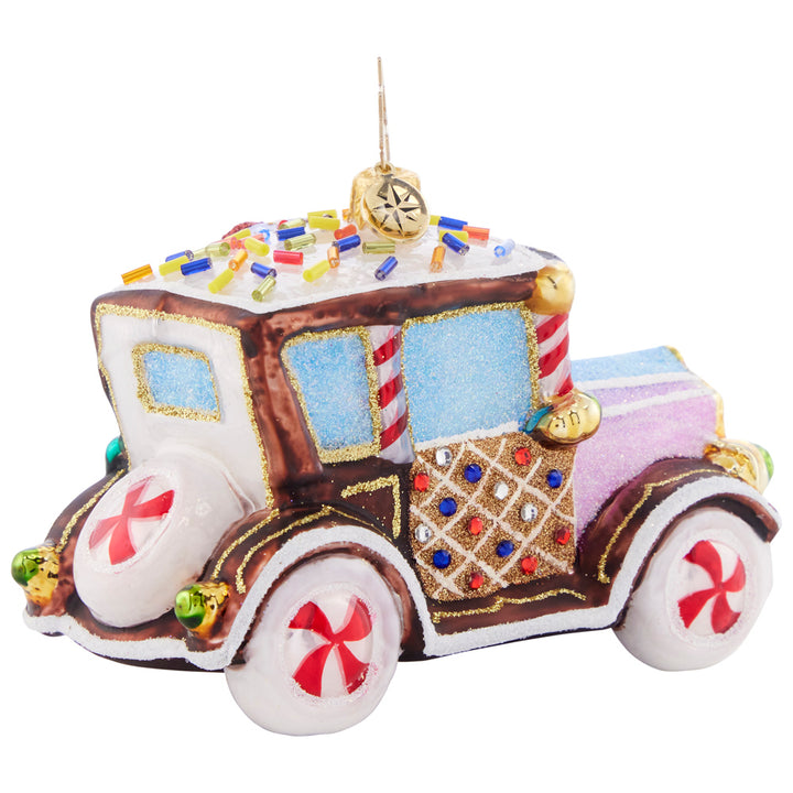 Back - Ornament Description - The Treatmobile: Beep beep! With shimmering peppermint rims and gumdrop detailing, this sugar-powered cookie car is one sweet ride.